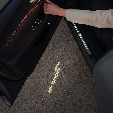 Opened driver's door with floor light projection Audi Q8 e-tron